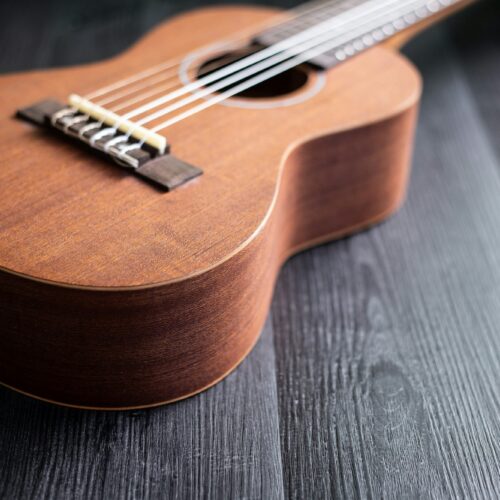 Ukulele on wooden tabletop