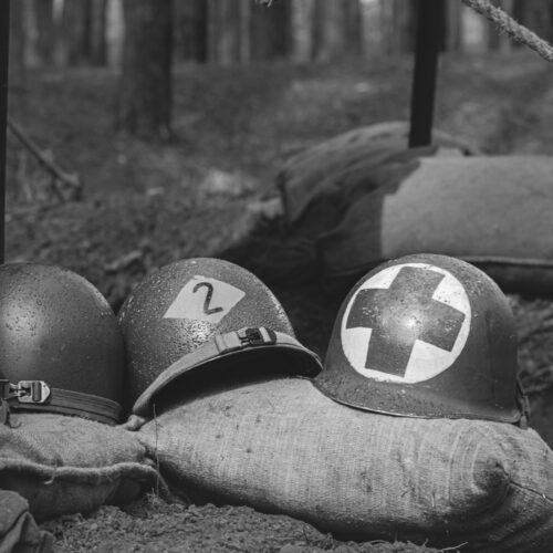 WWII American Metal Helmets Of United States Army Infantry Soldier At World War II. Helmets Near